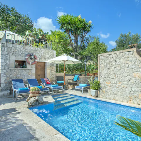 Plunge into the refreshing pool after a sun-soaking session