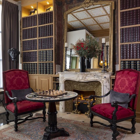 Play chess in the chic library before heading out for dinner