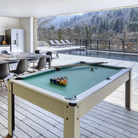Play a game of pool in the open-fronted pool house