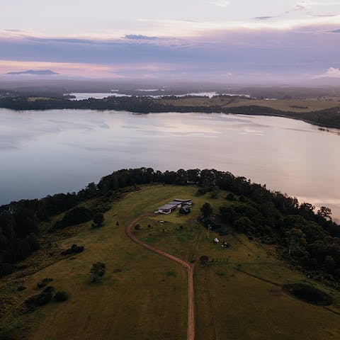 Explore the banks of Lake Coila within the home's forty-four acres of land