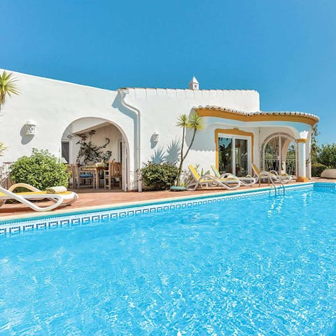 Spend your days lounging around the lovely pool