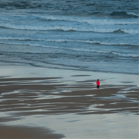 Feel the sand beneath your feet at mighty Watergate Beach, just a short drive away