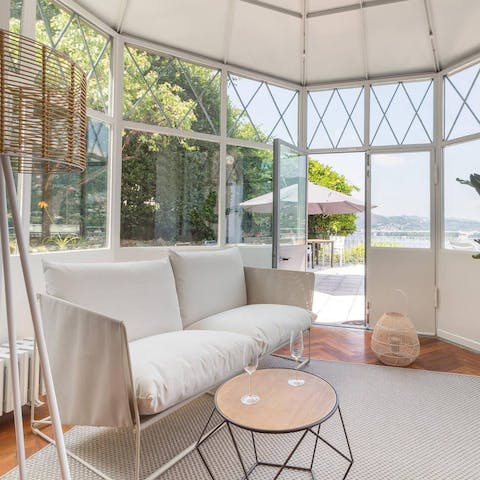Relax with a book in the sunny lake-facing conservatory