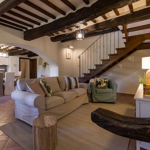 Sit back and relax beneath the beautiful exposed beam ceilings