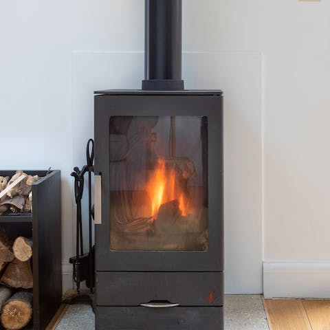 Get cosy around the wood-burning stove on chilly evenings