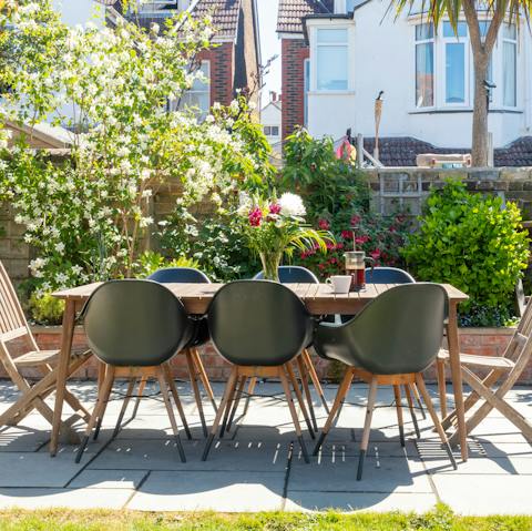 Grill up a delicious feast on the barbecue to enjoy at the outdoor dining table