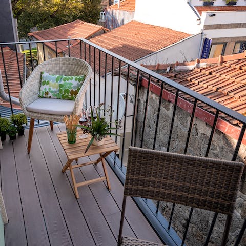 Sit out on the apartment's balcony and watch the sky change colour over Porto
