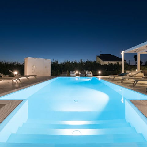 Enjoy a few leisurely lengths of your pool under the starlit sky
