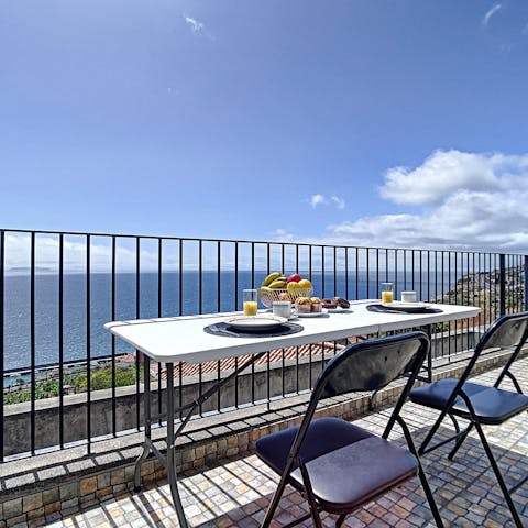 Dine under the sun on the private balcony with stunning views of the Atlantic ocean