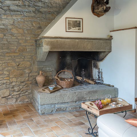 Unwind by the original fireplace in the rustic sitting room
