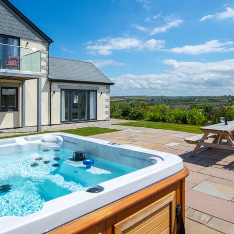 Indulge in a relaxing soak in the luxurious hot tub
