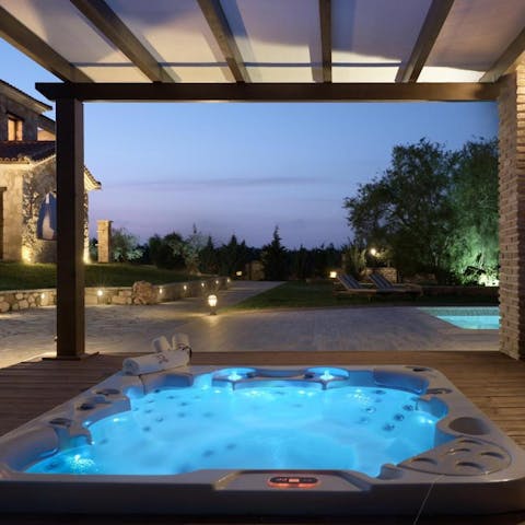 Watch the sun go down over the Zakynthos countryside from the hot tub