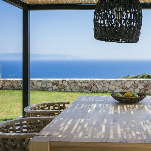 Feast on blue vistas as you dine alfresco beneath the pergola