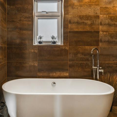Unwind with a long soak in the standalone tub