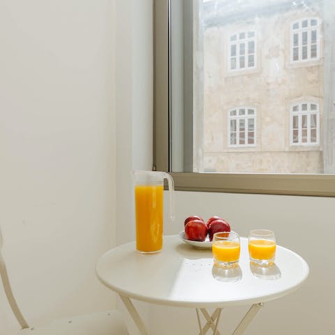 Sip your morning orange juice at the bright kitchen table