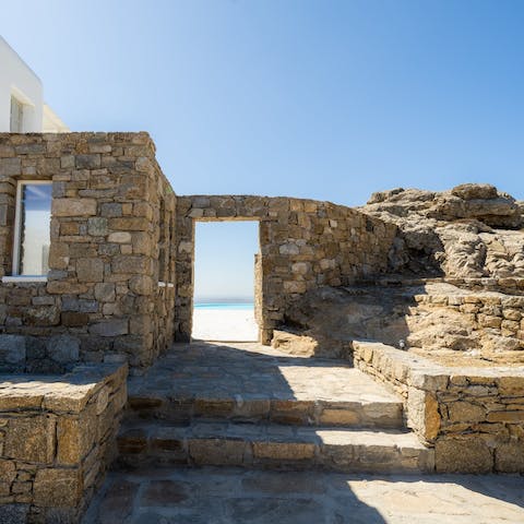 Admire the classic Cycladic style of this chic villa