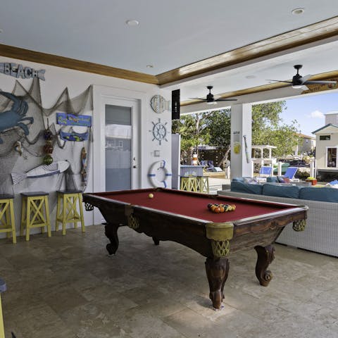 Hang out on the beachy terrace with games of pool