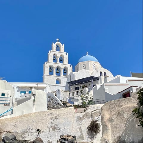Take a trip to the nearby village of Pyrgos, with its stunning castle