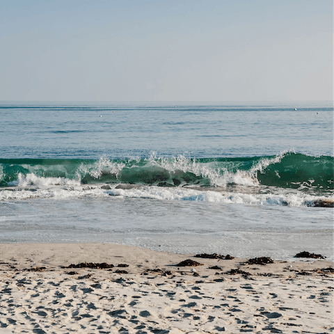 Drive thirteen minutes to the sandy stretch of the Grande Plage 