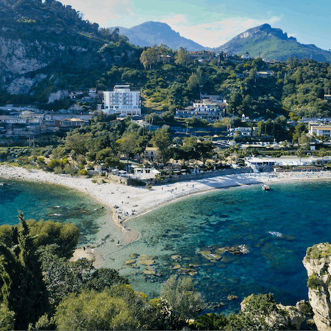 Take the short drive to Taormina and  explore its beaches and historic sights 