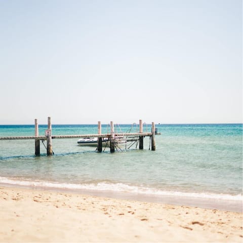 Take a breezy stroll or short drive to Playa de la Rada for a fun-filled beach day