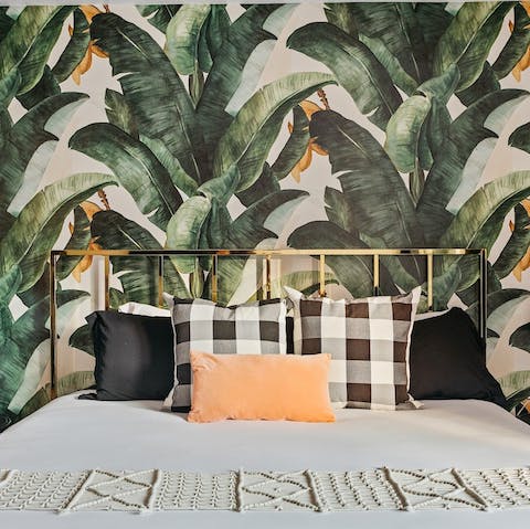 Glamorous banana leaf wallpaper in every bedroom