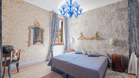 Sleep in true Venetian style, beneath Murano glass chandeliers
