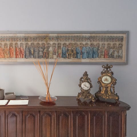 Admire the collection of anqitue carriage clocks and artworks throughout