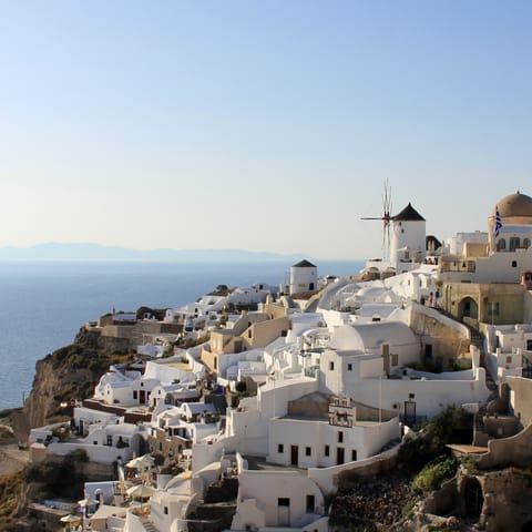 Enjoy the magical atmosphere of Santorini and admire stunning views across Oia 