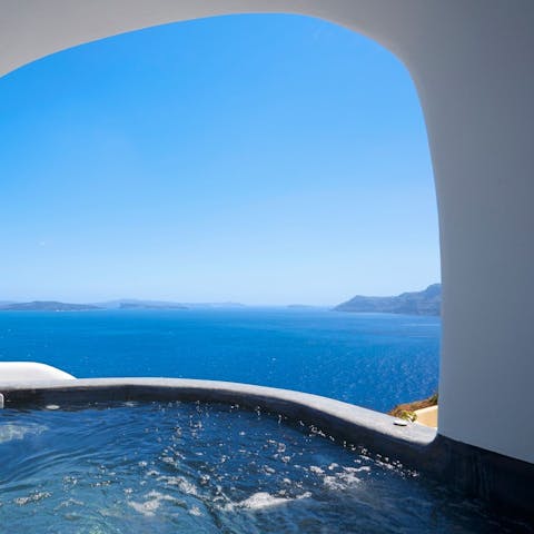 Gaze at the beautiful horizon from the cave style hot tub