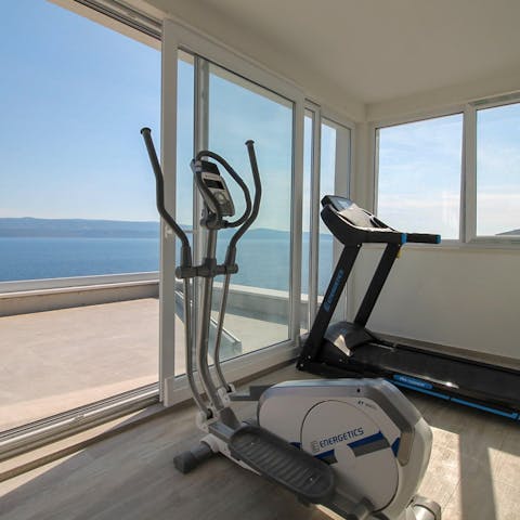 Make use of your fitness room and start your mornings with a workout session with a view