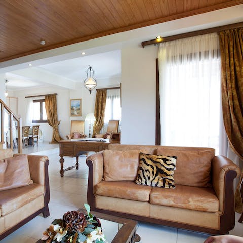 Take a moment to relax with a glass of wine in the comfortable living area