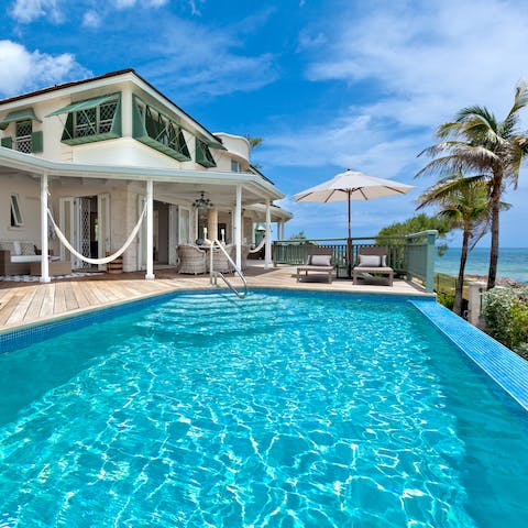 Step down into your crystal-clear sea-view infinity pool