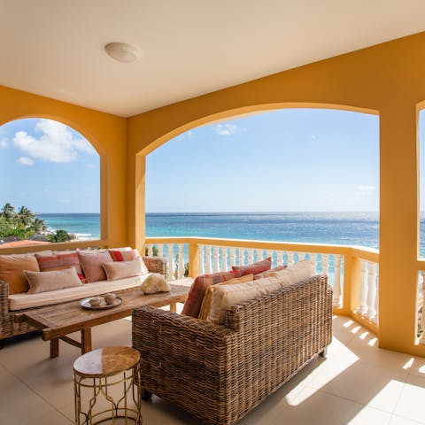 Sit out on the covered balcony and catch the sun setting over the ocean