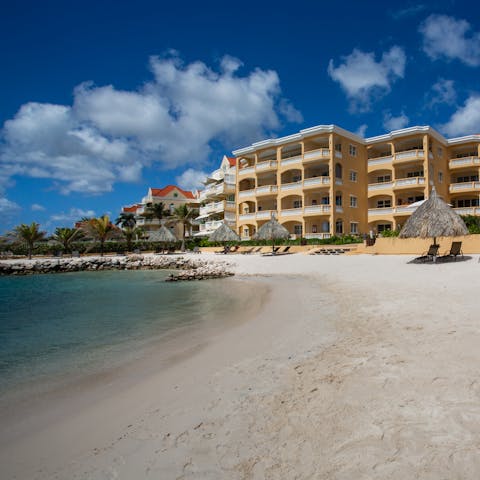 Head down to the apartment building's private beach and swim in the Caribbean Sea