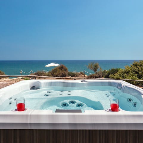 Admire the uninterrupted views whilst soaking in the hot tub