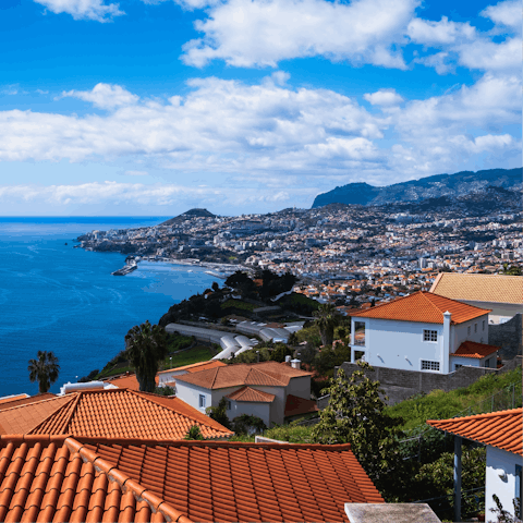 Sink your feet into the sand and breathe in the sea air at Funchal Bay