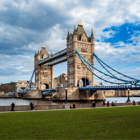 Watch boats pootle across the Thames by the iconic Tower Bridge, a ten minute walk away