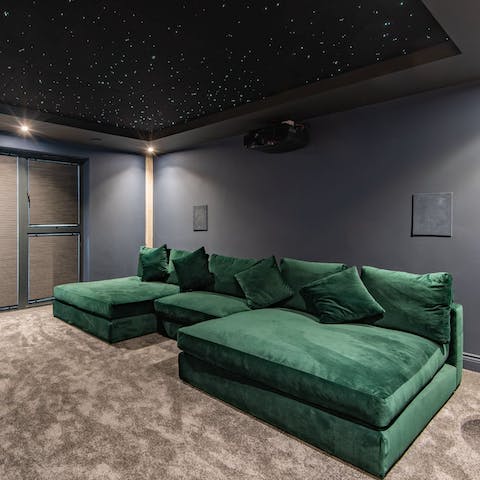 Stream your favourite films in the home cinema room
