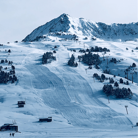 Carve your way down Baqueira's immaculately groomed pistes, a short drive away