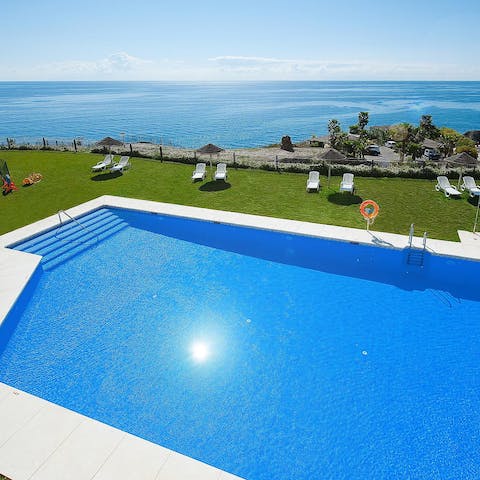 Swim some laps in the communal pool overlooking the sea