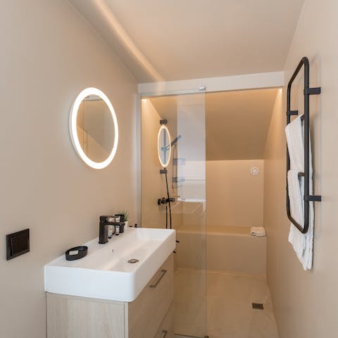 Start mornings with a soak under the bathroom's sleek shower