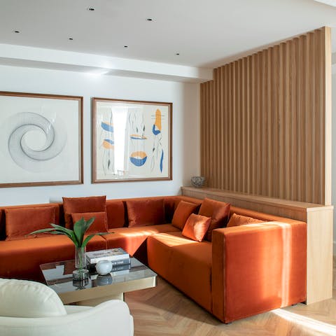 Sink into the velvet modular sofa in the stylish living room