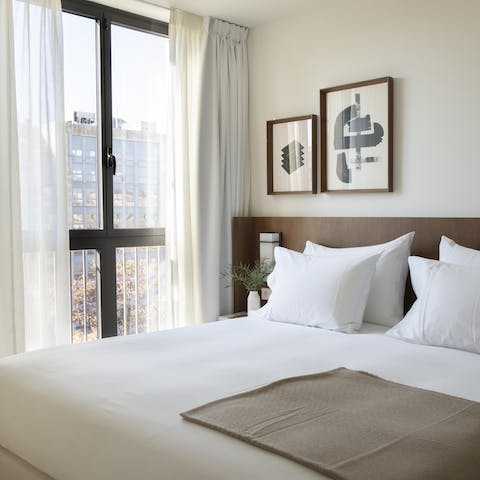 Wake up to Passeig de Gràcia views from the modern master bedroom