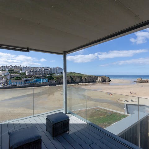 Step out with a cup of tea to look out over the beach and town