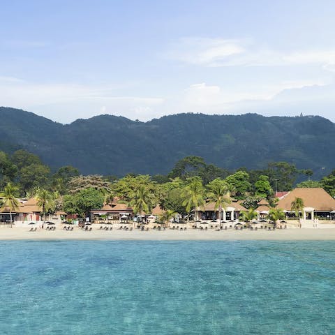 Stay in a mountain-backed resort, only a 300-metre stroll from sandy Lamai Beach