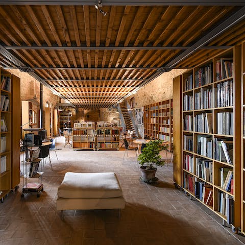 Select a book off the well-stocked shelves of the shared library