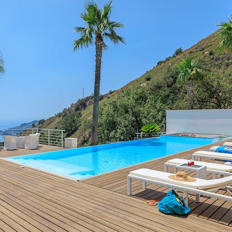 Admire stunning Ionian Sea views from the infinity pool and Jacuzzi