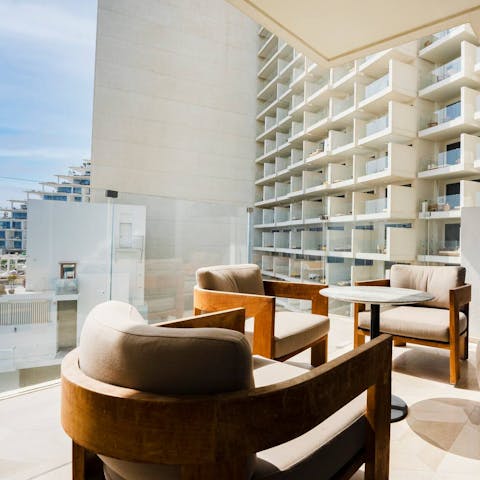 Take a seat out on the balcony and gaze out at the surrounding Palm Jumeirah