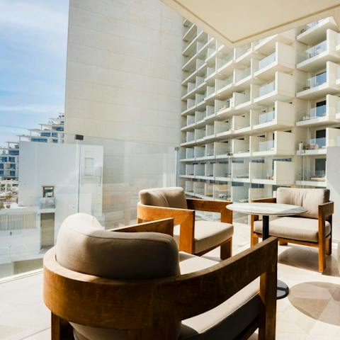 Take a seat out on the balcony and gaze out at the surrounding Palm Jumeirah
